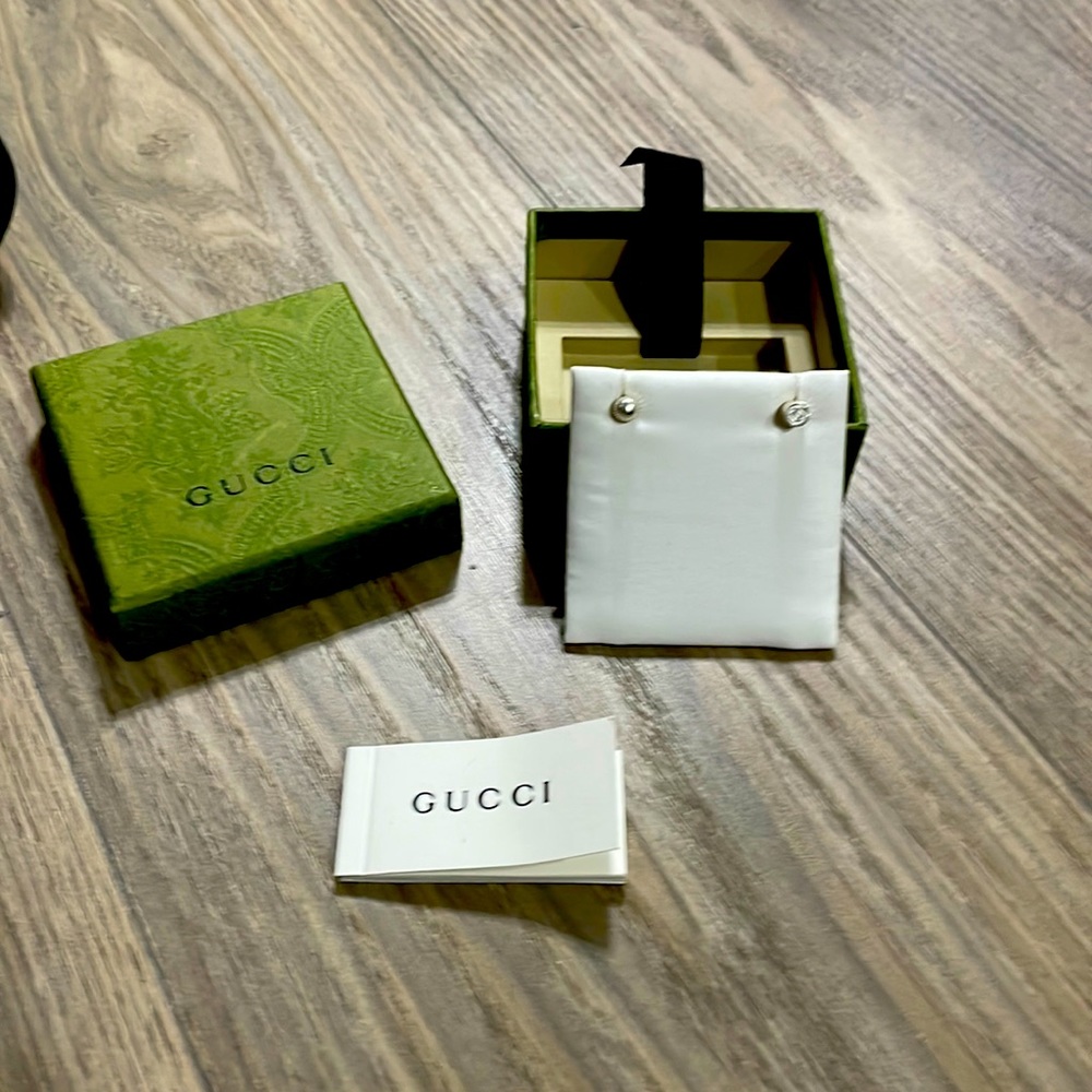 Authentic Gucci, mismatch earrings.